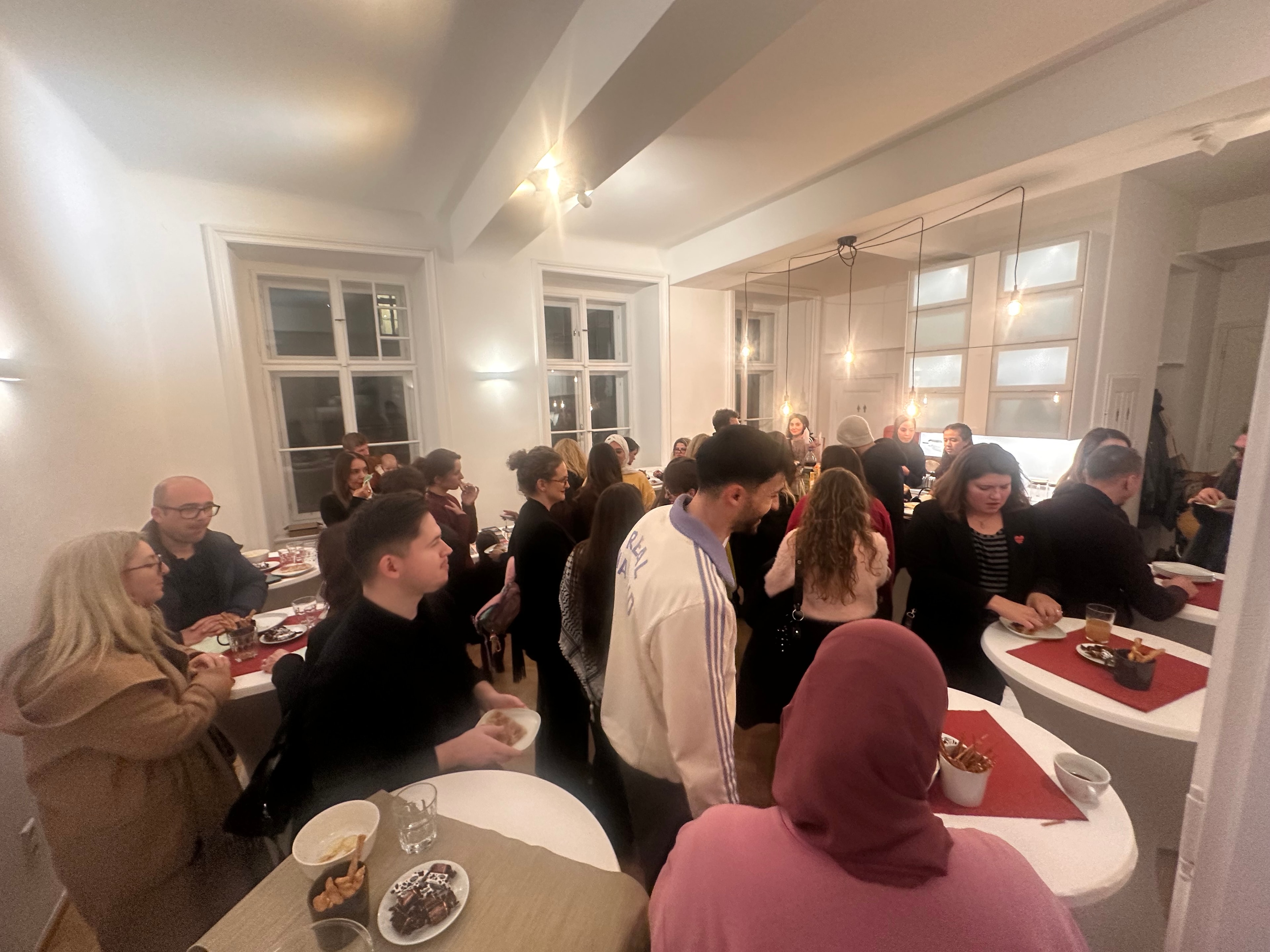 Guests gathering and socialising at the Breaking Archival Silences event in Vienna